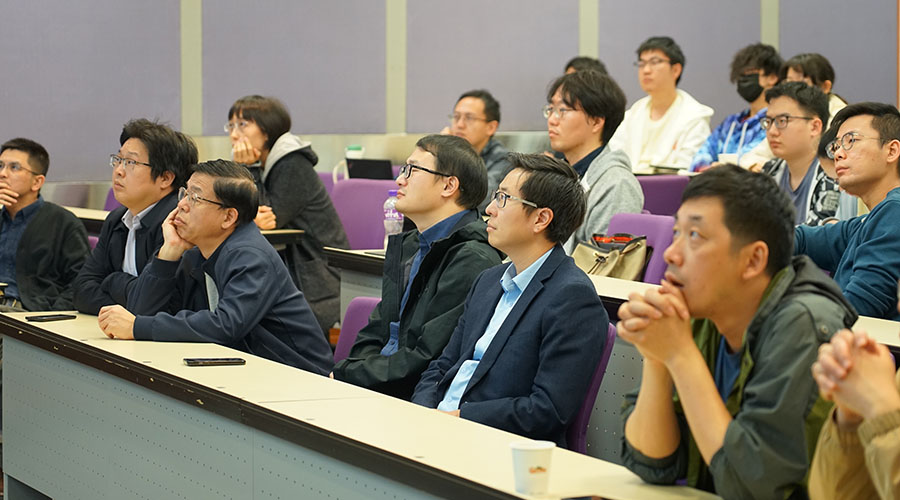 Attendees listen to a presentation at a satellite meeting in Hong Kong